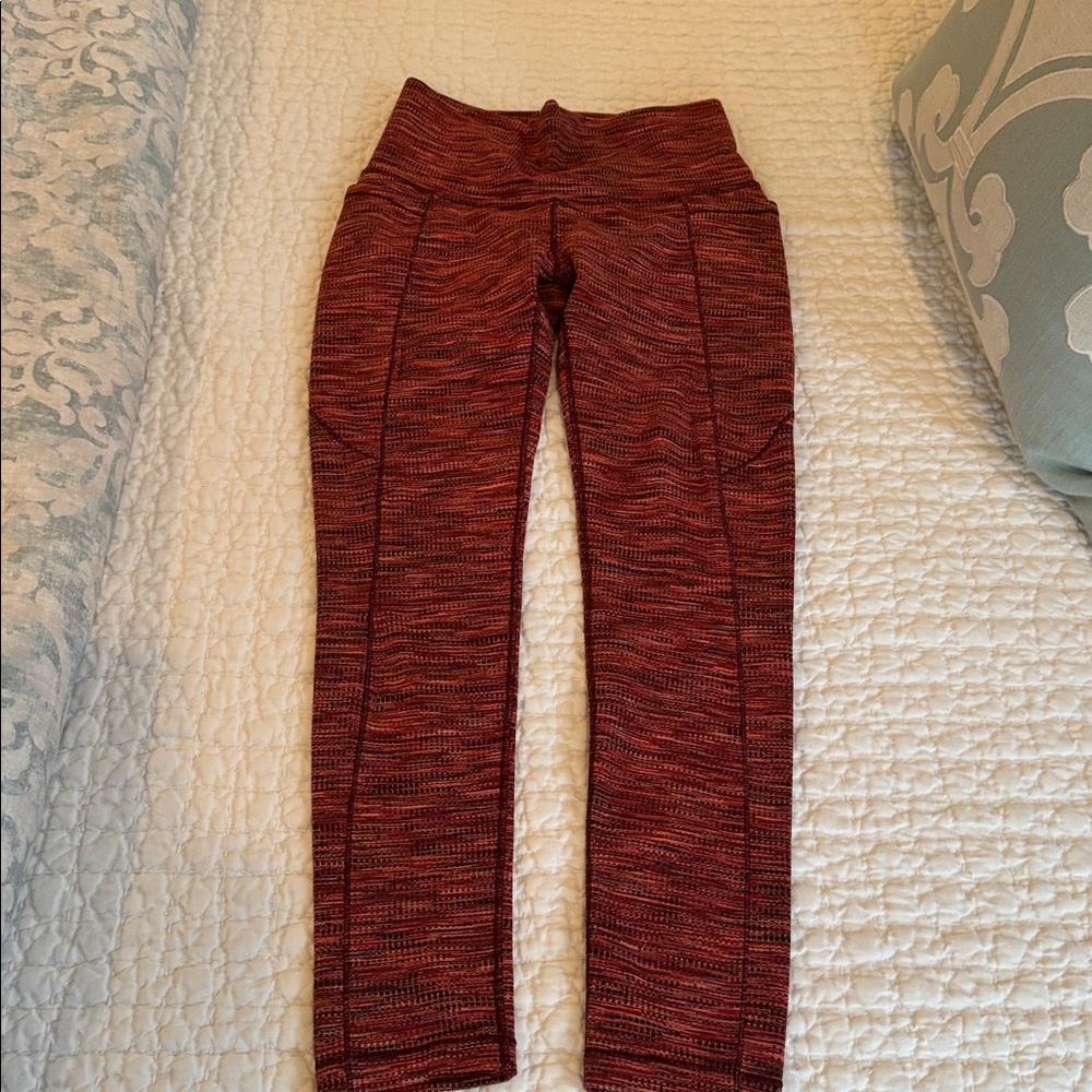 Women's Red leggings with side pockets.